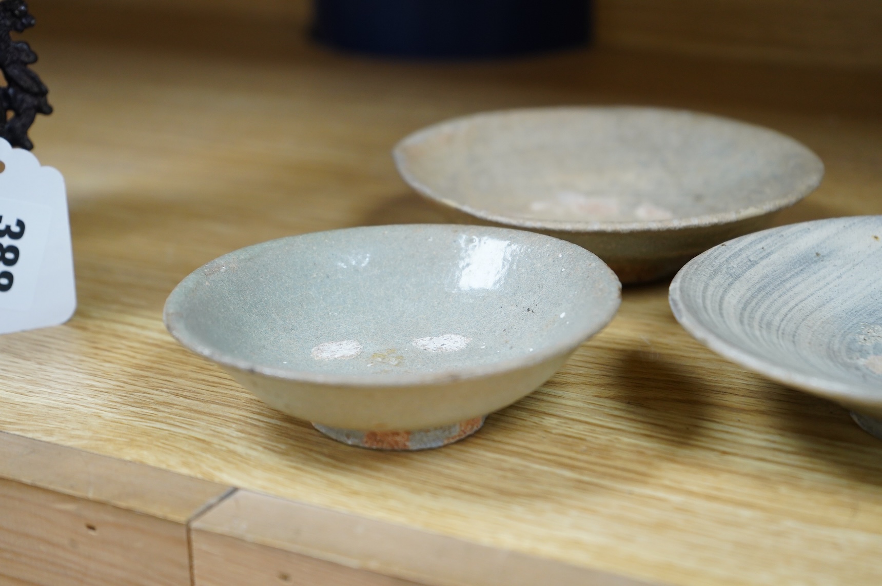 A Korean celadon dish and two Korean Pongchong dishes, Goryeo dynasty, largest 13cm